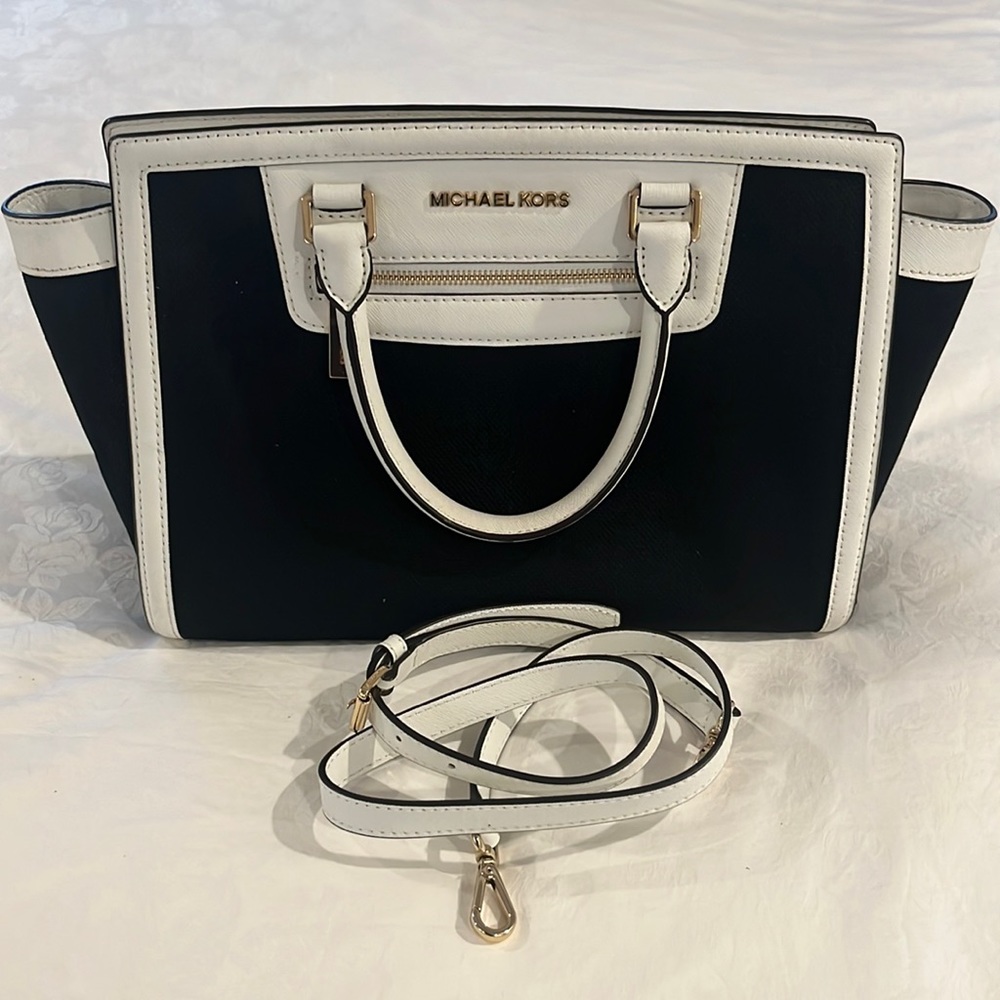 Michale Kors black and white bag with white shoulder strap.  With dust bag.